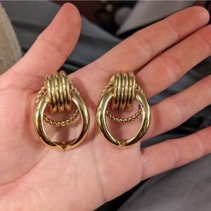 Vintage 80's Gold Tone Fashion Earrings; twisted circle; 80's costume